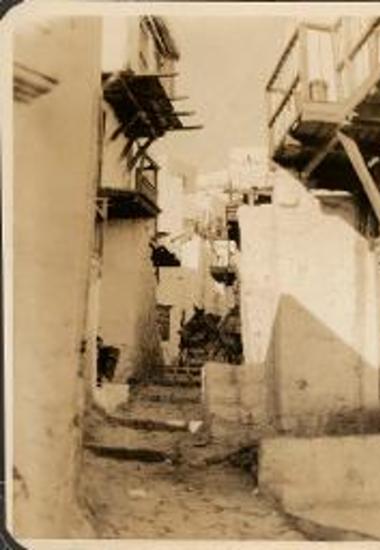Skyros. Narrow, village street with overhanging baolconies