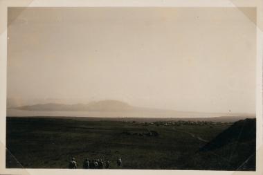 Corinth, people walking in a field