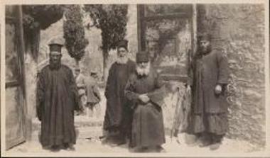 Chios. Priests and monks posing in front of the monastery's gate