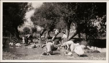 Orchomenos. Village women washing clothes by a stream.