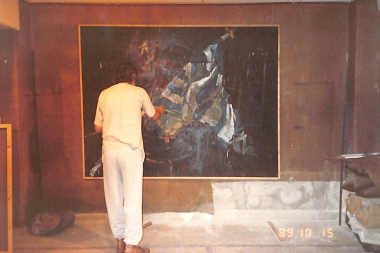 Painting one of his works depicting the Greek Flag