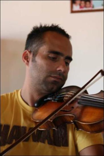 Ikaria Island (Agios Kirykos) 2008: The musician Giannis Fragos plays the violin