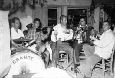 Lemnos Island (Thanos), late 1950s early 1960s: Musicians in a kafeneio (local traditional cafeteria)