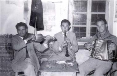 Lemnos Island (Kalliopi), late 1950s or early 1960s: A folk feast (glenti) in a kafeneio (local traditional kafeteria)