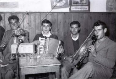 Lemnos Island (Kontopouli), late 1950s or early 1960s: A folk feast (glenti) in a kafeneio (local traditional cafeteria)