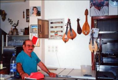 Lemnos  Island (Tsimandria), 2001:The musician Athanasios Kotsinadelis at his kafeneio (local traditional cafeteria)