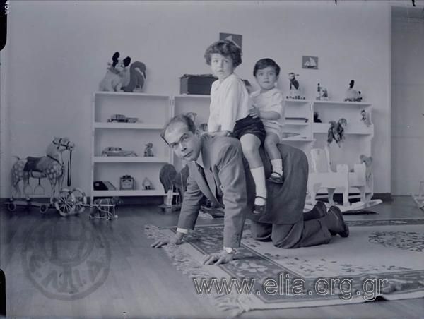 Petros Empedoklis playing with his kids, Grigoris and Alekos.