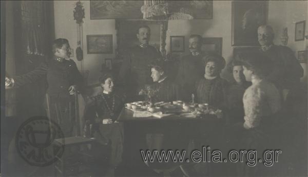 Ippokratis and Alexandra Papavasiliou, Didis and Aglaïa Delaporta, Ioannis Metaxas, Xenophon Stratigos and three women inside a house