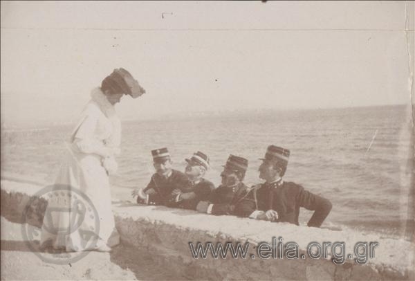 Dintis and Aglaia Delaporta, Georgios Papakonstantinos, Xenofon Stratigos and Ioannis Kaliontzis in the yard next to the sea.