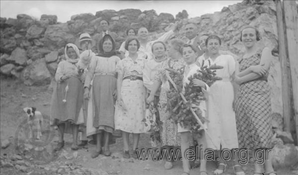 Nikolaos and Eleni Makka, with a company of men and women