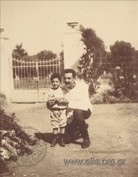 Paul Melas with his son, Miki.