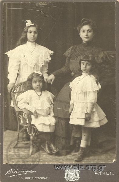 Portrait of a woman with three girls.