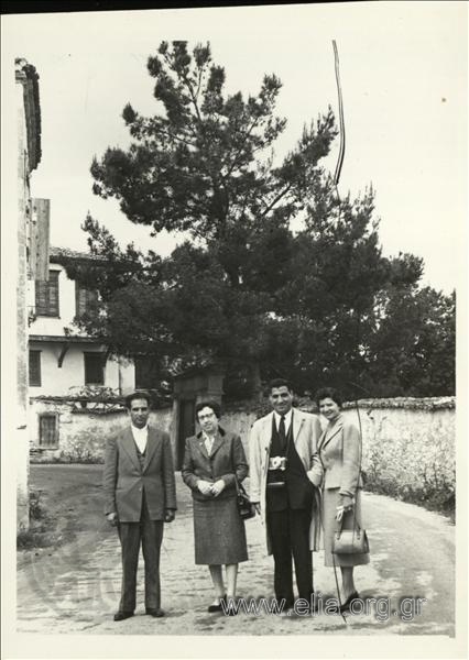 Eleni St. Douka and company on a country street.