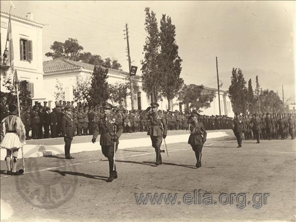 Parade of troops in front of King Georgios II in an infantry camp