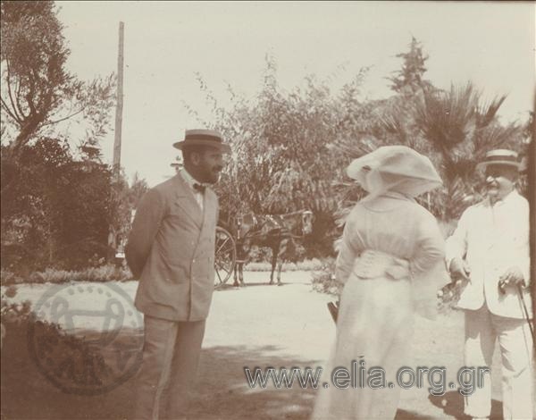 Sofoklis Dousmanis in company in a garden.