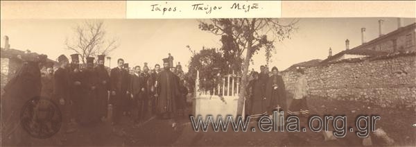 Priests and citizens next to the grave of Paul  Melas.