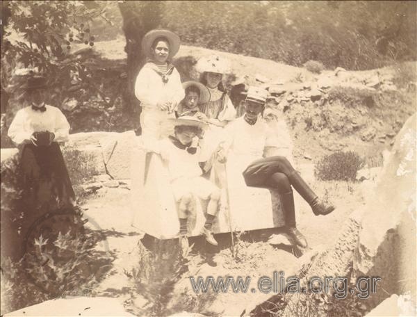 Paul Melas with his son, Miki, and the children of Mela's family.