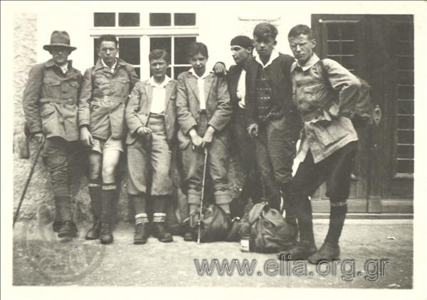 Group portrait, Stefanos G. Straight with a group of mountaineers in a courtyard.