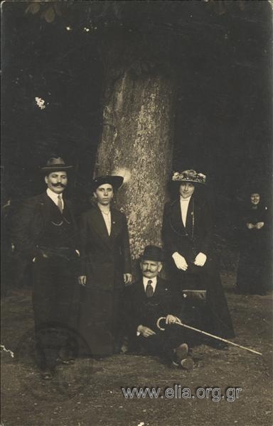 A. Vichos with his wife and a couple