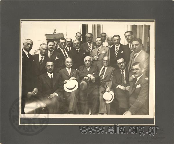 Group portrait of men (members of the municipal council of the Municipality of Athens). Between them Kostas Kotzias and A. Vichos.