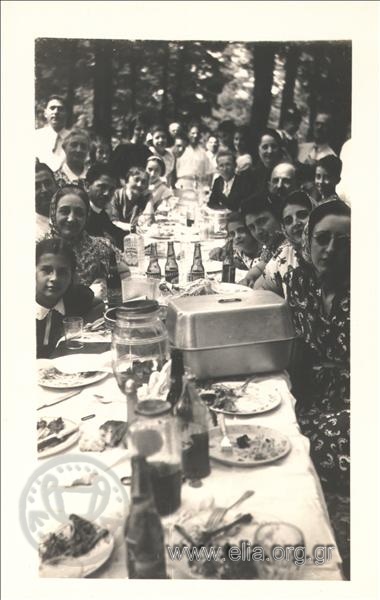 Group portrait of diaspora Greek s of America at dinner.