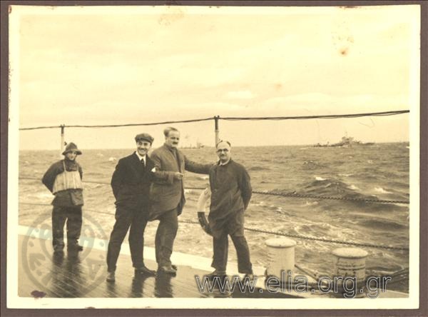 Konstantinos Kotzias and some strange men on board ship Averof returning from Florenceμε where he had been for the tranport of the kings' mortal remains