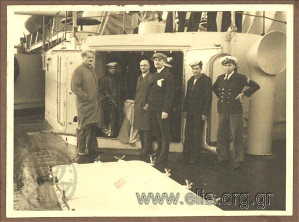 Konstantinos Kotzias and some strange men on board ship Averof returning from Florenceμε where he had been for the tranport of the kings' mortal remains