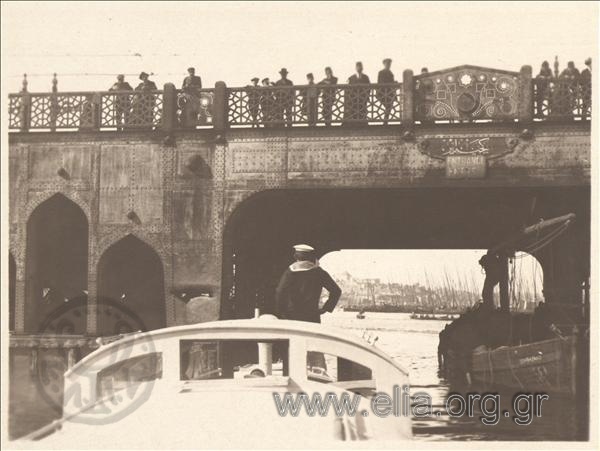 Asia Minor campaign: steam launch of the Military Navy sails under a bridge.