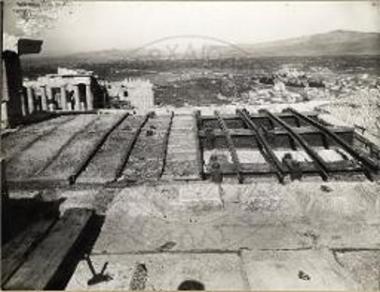 Erechtheion. The north porch. Covering of the iron beams of the restored roof with terrace (views of work progress).