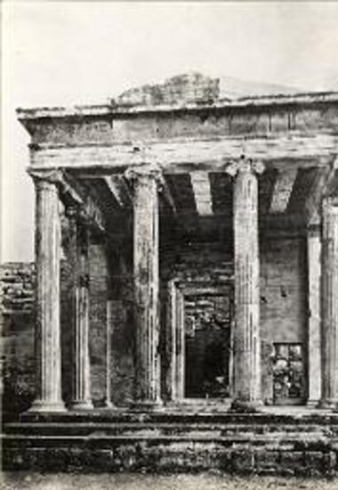 Erechtheion. The north porch as seen from the north, after the restoration. One should notice the iron slabs that support the marble beams of the roof and the restored entablature (two new blocks of eleusinian marble).