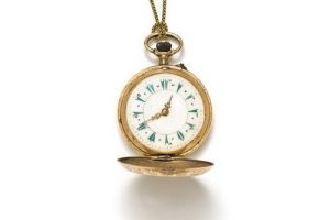 Gold pocket watch with chain