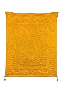 Moustard yellow silk cloth with woven pattern of leaves, for a woman in childbed.