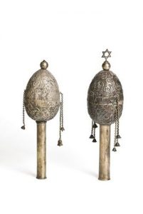 Egg-shaped silver-plated Torah finials, dedicated in memory of Nazi victims and Rebecca, wife of Zaharias Vital.