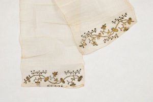 Cream linen with gold metal thread embroidery, from Larissa.