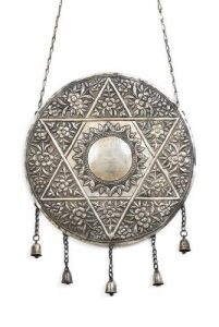 Silver Torah shield with dedication.