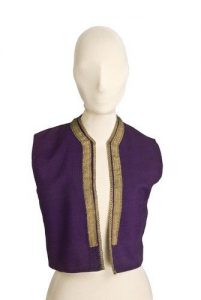 Purple waistcoat with gold braid trim.