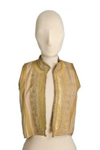 Cream waistcoat with woven gold stripes and floral pattern, standing collar, edged with gold braid and embroidery.