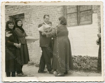 The giving of the baby after the baptism