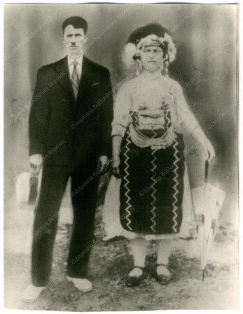 Wedding outfit with an umbrella as an accessory