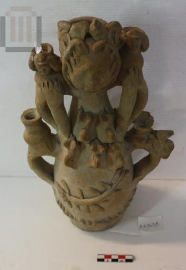 Anthropomorphic vase with plastic decoration