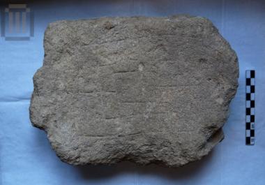 Stone with incised game