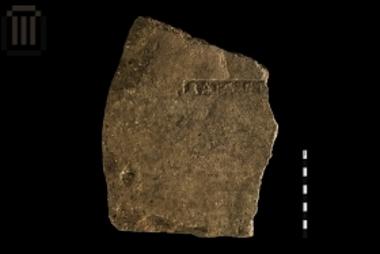 Part of an inscribed clay roof tile from Ladochori