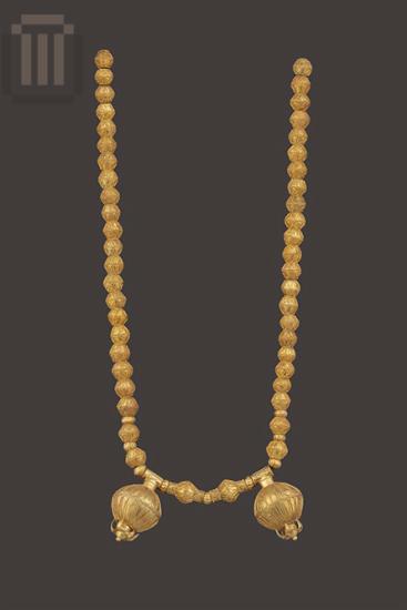 Nine bronze biconical necklace beads